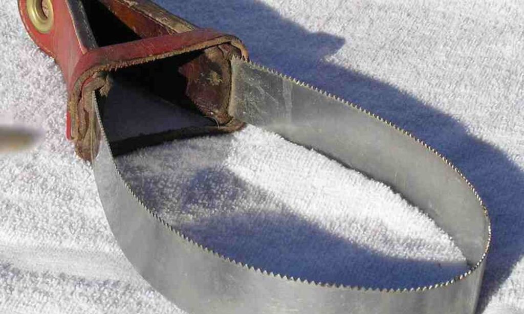Traditional metal shedding blade used for removing loose seasonal horse coat hair